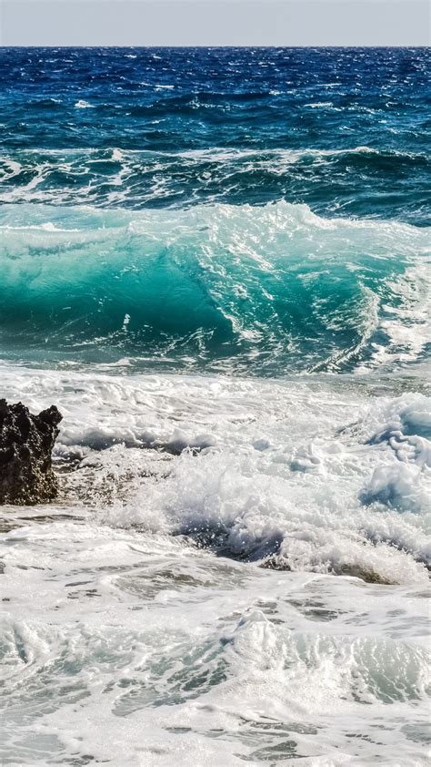 Download 1080x1920 Ocean Waves Rock Horizon Foam Sea Wallpapers