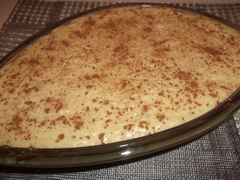 Desligue o fogo, acrescente o leite de coco e polvilhe canela em pó para servir. AS RECEITAS DA POLLY: ARROZ DOCE CREMOSO