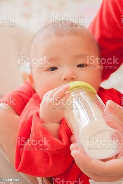 Bottle Feeding Baby Stock Photo Download Image Now Adult Asia