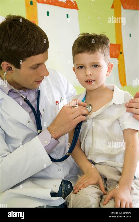 Doctor Examining A Boy Stock Photo Alamy