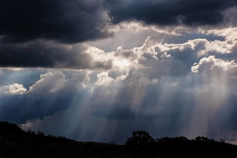 Rain And Sunrays On A Blue Sky Stormy Dark Clouds Stock Image Image