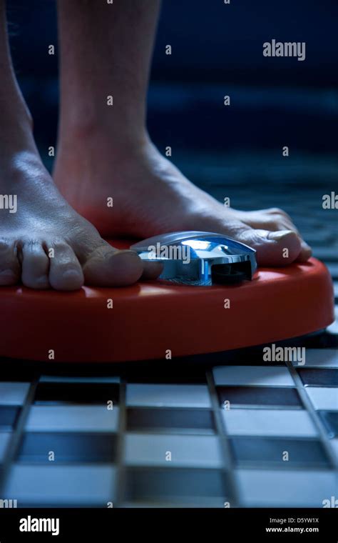 Close Up Of Feet On Weighing Scale Stock Photo Alamy