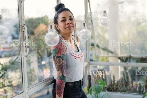 Portrait Of Beautiful Latina Mexican Millennial Woman With Tattoos Near
