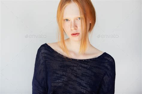 Close Up Portrait Of Caucasian Teenage Girl With Red Hair Blue Eyes