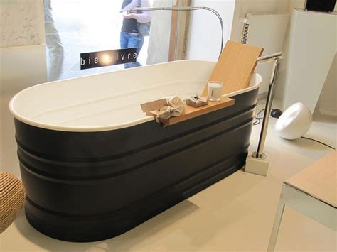 A soaking tub is much simpler than a spa or traditional hot tub. Is this custom fabricated, or is it actually a painted ...