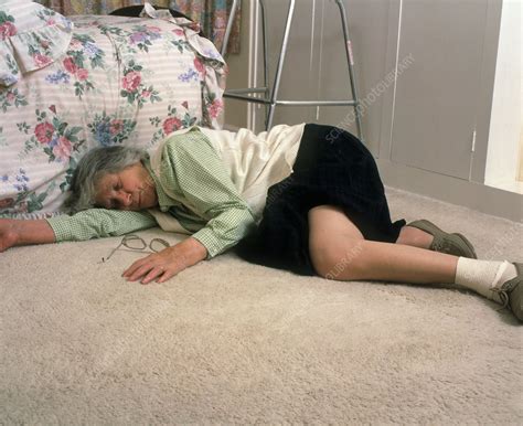 Lay requires a direct object. Elderly woman lying on floor after a fall - Stock Image ...