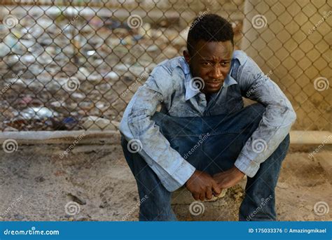 Young Homeless African Man Sitting In The Streets Stock Photo Image