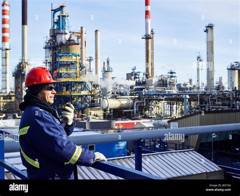 Tradesman Working At A Refinery; Edmonton, Alberta, Canada Stock Photo ...