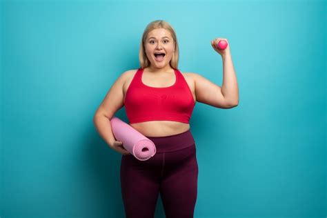 Premium Photo Overweight Woman Does Gym At Home Satisfied Expression