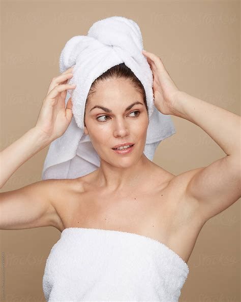 Woman Putting A Towel On Her Head After Shower Isolated Studio