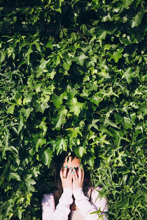 Girl Hiding Her Face With Her Hands In The Nature By Stocksy Contributor Michela Ravasio