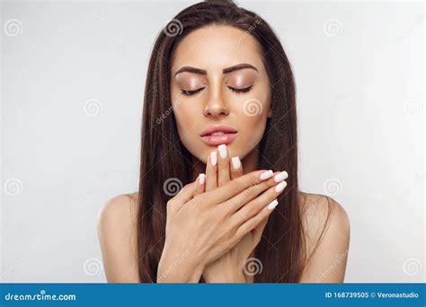 beautiful woman portrait skin care concept portrait of female hands with french manicure nails