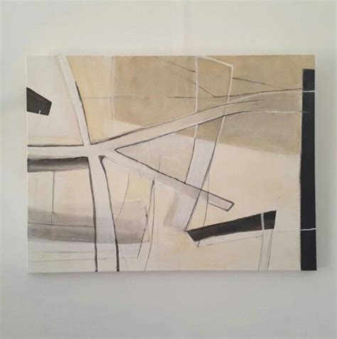 An Abstract Painting Hanging On The Wall In A White Walled Room With