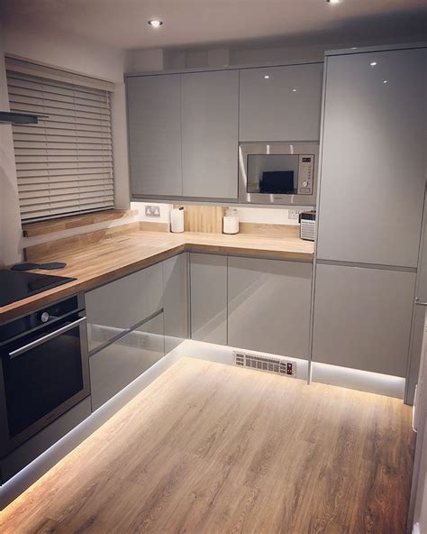 The modernist design offers both elegance and practicality. Finally, our new kitchen! Gloss Grey handleless ...