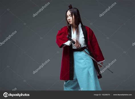 Asian Woman Kimono Holding Katana Sword Looking Camera Isolated Grey
