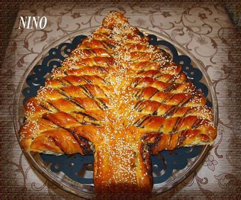 To braid the loaf divide dough into 9 equal strands. Braided Nutella Christmas Tree Bread - DIY Cozy Home