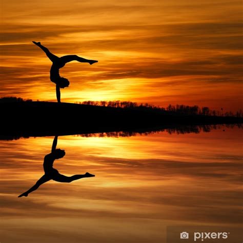 Poster Silhouette Of Female Gymnast Doing A Handstand In Sunset Pixersus