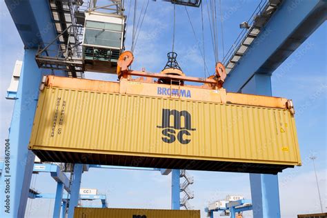 Transtainer Crane Moving An Msc Shipping Container To A Storage