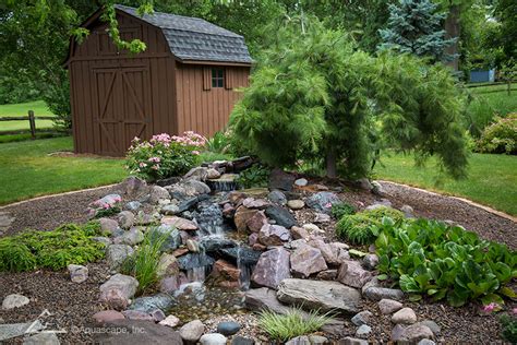 The husband put in a pondless waterfall as part of our big backyard makeover! Pondless Waterfall, DIY Pondless Waterfalls | Aquascape