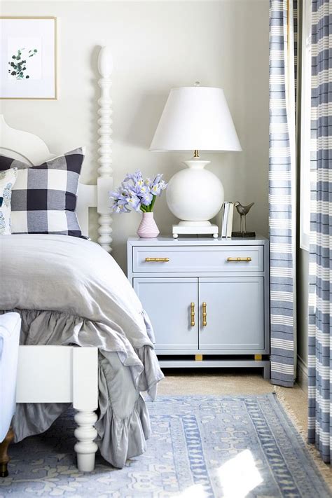 Nightstands with drawers provide a place to put things out of sight while nightstands with shelves provide open storage space. Bedroom Nightstand Decorating Ideas Large nightstand with white table lamp small vase and boo ...