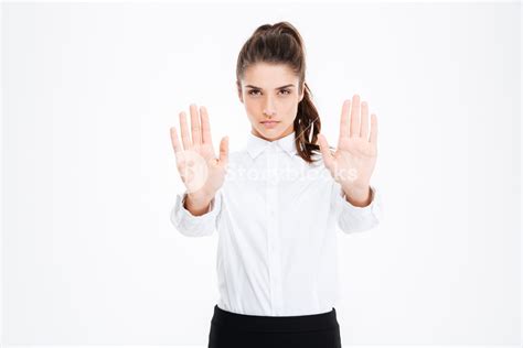Professional Young Businesswoman Demonstrating Stop Gesture Royalty