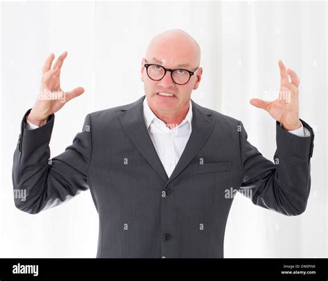 Bald Headed Man In A Suit Is Upset Stock Photo Alamy