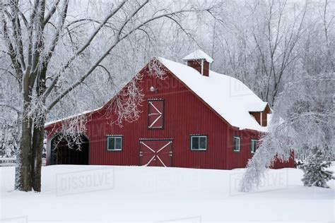 A Red Barn Covered With Snow In Winter Iron Hill Quebec Canada