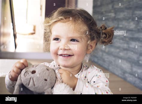 Little Girl Holding Stuffed Toy Smiling Portrait Stock Photo Alamy