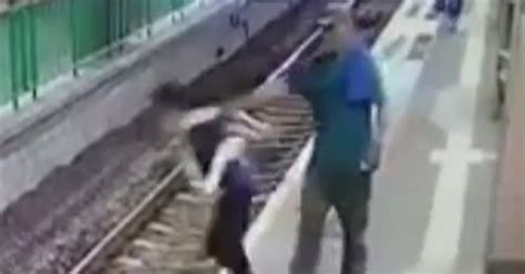 Chilling Moment Man Pushes Cleaner Onto Train Tracks At Station Then Calmly Walks Off World
