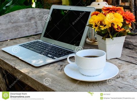 Laptop computer with blank screen for mock up template background, business technology and lifestyle background concept. Coffee, Laptop On Wood Floor With Flower Stock Image ...