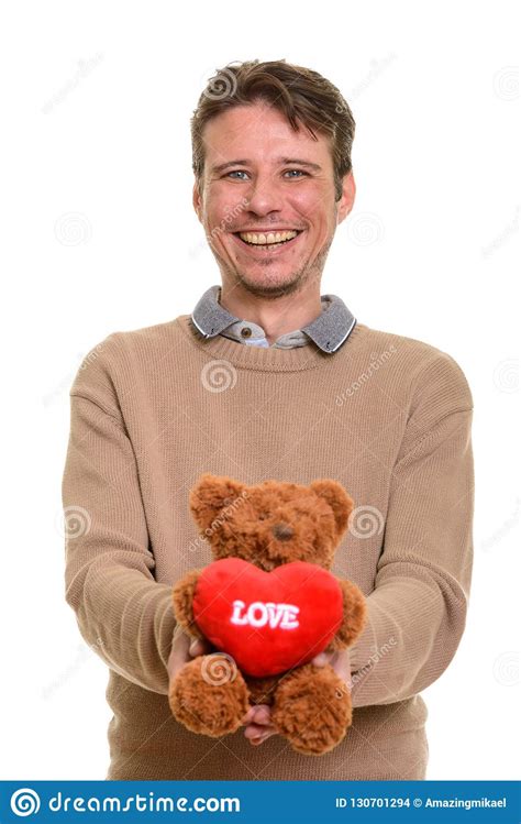 Happy Caucasian Man Holding Teddy Bear With Heart And Love Sign Stock