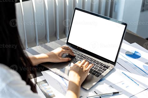 Person Typing On Laptop Keyboard On Laptop Screen Blank White