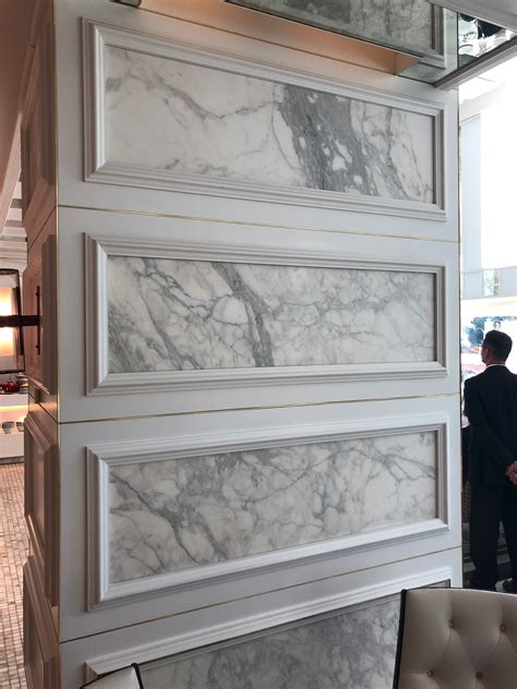 Marble Wall Panelling With Wooden Framing Inside The Conversatory In