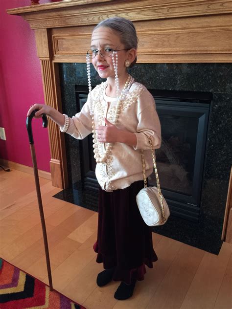 100th Day Of School Old Lady Makeup Peals Glasses Walking Cane Grey Hair In A Low Bun And