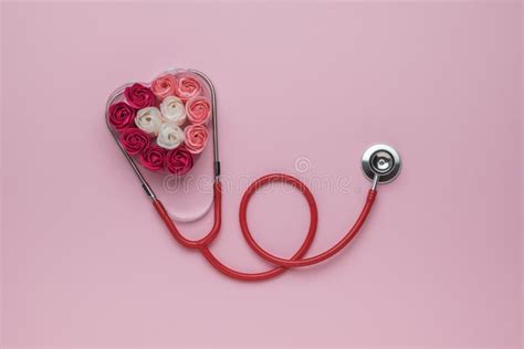 A Red Stethoscope And A Heart Made Of Rosebuds The Concept Of Medical