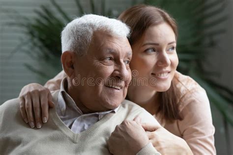 Happy Grown Granddaughter Lean To Beloved Elderly Grandpa Giving
