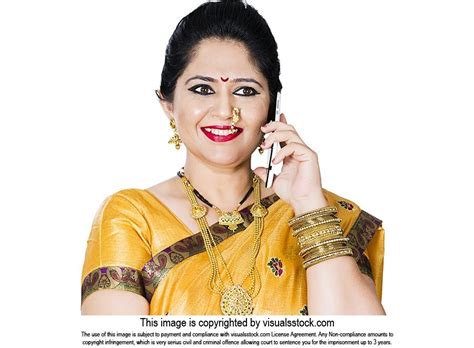 traditional indian maharashtrian woman housewife talking on mobile phone