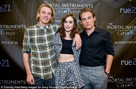 Lily Collins Appears Polished In A Floral Frock To Promote The Mortal Instruments A Day After