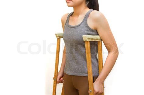 Woman Walking With Crutcheswalking Aid Stock Photo