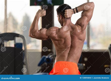 Muscular Man Flexing Muscles In Gym Stock Photo Image Of Model Human