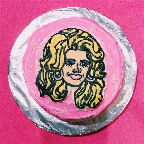 A Pink Cake With A Drawing Of A Woman S Face On It