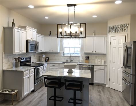Maybe you would like to learn more about one of these? white cabinets, granite island, White backsplash, subway tile, platinum grout, stainless steel ...