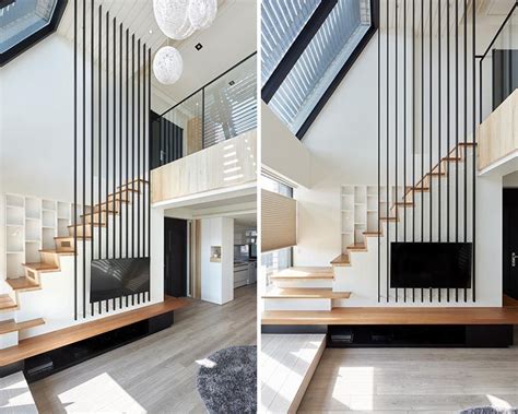 This frame is usually made out of aluminium. Long Metal Poles Draw Attention To The High Ceiling Of This Apartment | Stairs design modern ...