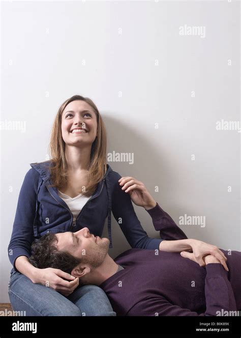 Man Resting Head On Woman S Lap Stock Photo Alamy
