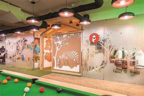 An Indoor Pool Table And Billiards In A Brightly Lit Room With Green Walls