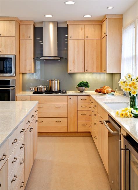 This large kitchen is full of light thanks to its bright kitchen paint colors. kitchen with maple cabinets color ideas 4 | Birch kitchen cabinets, Kitchen cabinets and ...