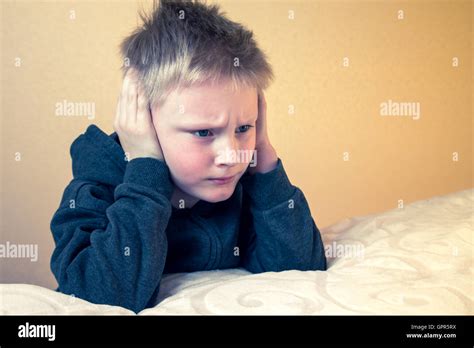 Sad Tired Worried Unhappy Kid Boy Teen Close His Ears With His Hands