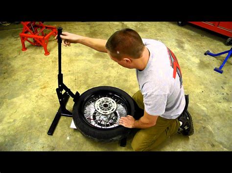 How to break a car or atv tire bead using a ratchet strap, 2x4 and a floor jack. Redline Engineering Motorcycle Bead Breaker Stand - YouTube