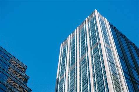 Glass Skyscrapers Under Cloudless Bright Blue Sky · Free Stock Photo