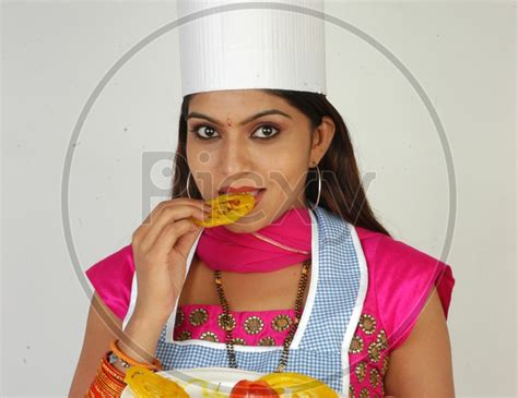 Image Of An Indian Woman Wearing A Kitchen Apron With A Jalebi Or Jilebi Plate On An Isolated